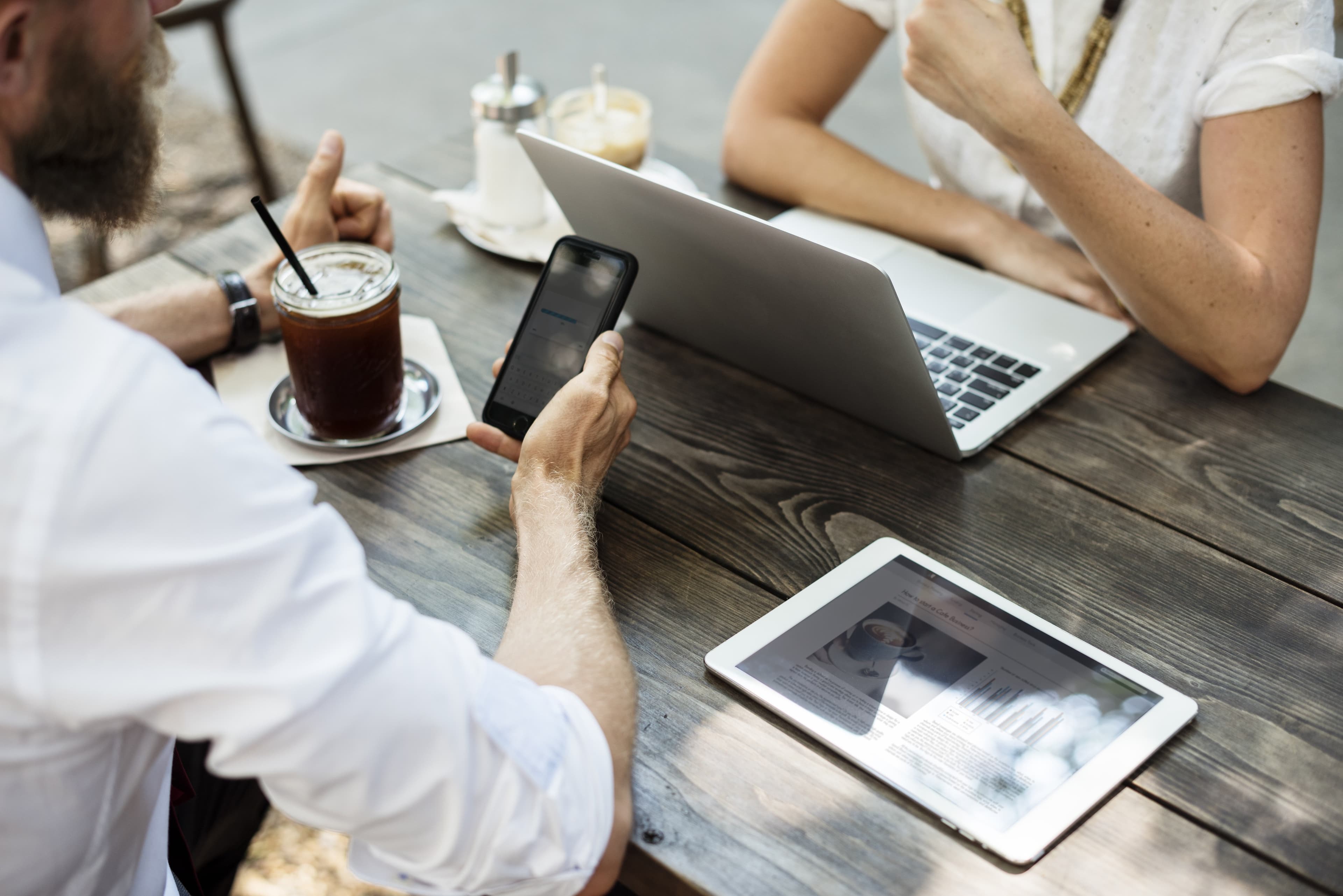 People connecting over food and technology at a local cafe